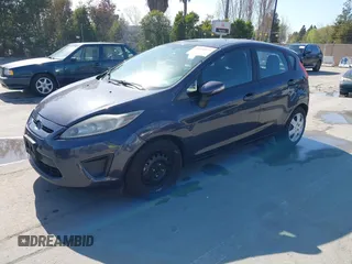 2013 Ford Fiesta SE with VIN 3FADP4EJ8DM221179, listed as a IAAI auction lot 41958070 with 197,454 mi miles. Bid and sale history available at carsss.com. Image 2.