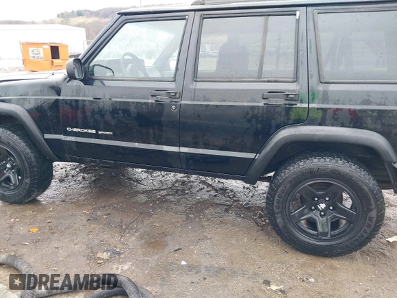 1999 Jeep Cherokee Sport with VIN 1J4FT68S6XL598558, listed as a IAAI auction lot 41549504 with 238,004 mi miles. Bid and sale history available at carsss.com. Image 14.