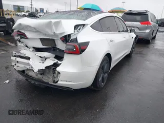 2020 Tesla Model 3 Standard Range Plus with VIN 5YJ3E1EA2LF740225, listed as a IAAI auction lot 41781554 with 46,703 mi miles. Bid and sale history available at carsss.com. Image 4.
