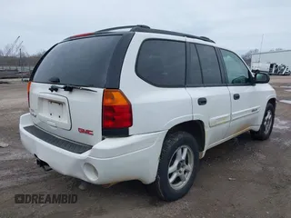 2004 GMC Envoy SLE with VIN 1GKDT13SX42357048, listed as a IAAI auction lot 41601126 with 304,101 mi miles. Bid and sale history available at carsss.com. Image 4.