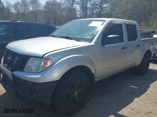2011 Nissan Frontier PRO-4X with VIN 1N6AD0EVXBC407089, listed as a IAAI auction lot 42113537 with 124,853 mi miles. Bid and sale history available at carsss.com. Image 2.