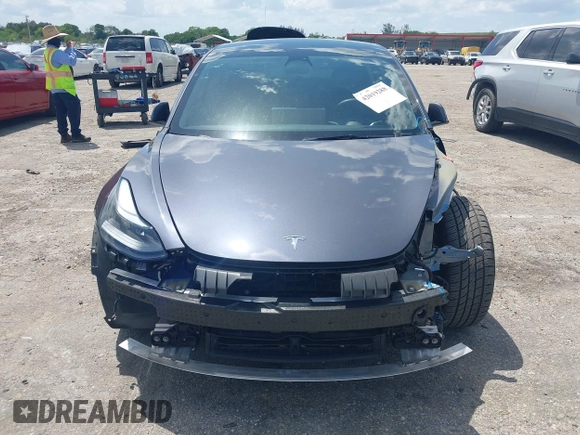 2023 Tesla Model 3 with VIN 5YJ3E1EAXPF575448, listed as a IAAI auction lot 42019288 with 33,859 mi miles and . Bid and sale history available at carsss.com. Image 13.
