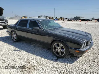 2002 Jaguar XJ with VIN SAJDA15BX2MF47193, listed as a Copart auction lot 49065275 with 69,544 mi miles and Salvage title. Bid and sale history available at DreamBid. Image 4.
