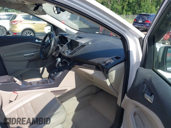 2015 Ford Escape Titanium with VIN 1FMCU9J90FUA05005, listed as a IAAI auction lot 42501764 with 121,993 mi miles and . Bid and sale history available at DreamBid. Image 5.