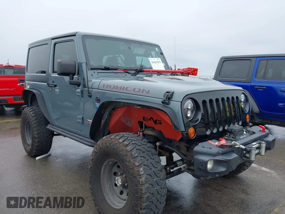 2013 Jeep Wrangler Rubicon 10th Anniversary with VIN 1C4BJWCG2DL651815, listed as a IAAI auction lot 41643919 with 98,297 mi miles and . Bid and sale history available at DreamBid. Image 1.
