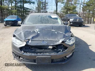 2018 Ford Fusion SE z VIN 3FA6P0LU6JR118226, wystawiony jako IAAI lot #41811406 z przebiegiem 165 352 mil mil oraz . Historia ofert i sprzedaży dostępna na DreamBid. Obrazek 13.