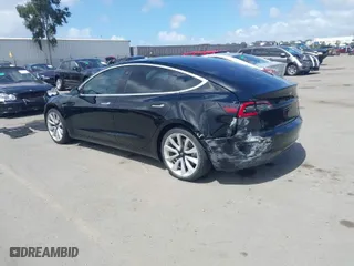 2018 Tesla Model 3 Long Range Battery with VIN 5YJ3E1EA3JF060296, listed as a IAAI auction lot 41901636 with 110,847 mi miles. Bid and sale history available at carsss.com. Image 3.