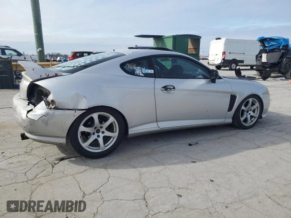 2003 Hyundai Tiburon GT z VIN KMHHN65F13U102985, wystawiony jako Copart lot #45294325 z przebiegiem 326 919 mil mil oraz Szkoda całkowita • Salvage title. Historia ofert i sprzedaży dostępna na DreamBid. Obrazek 3.