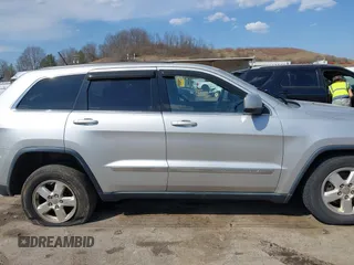 2013 Jeep Grand Cherokee Laredo with VIN 1C4RJFAG5DC634685, listed as a IAAI auction lot 41792147 with 260,594 mi miles. Bid and sale history available at carsss.com. Image 13.