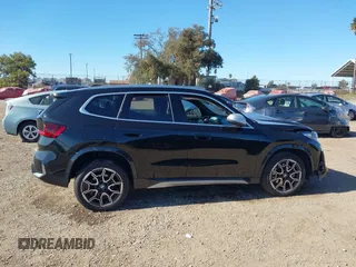 2023 BMW X1 xDrive28i with VIN WBX73EF05P5W59704, listed as a IAAI auction lot 41319741 with 11,637 mi miles. Bid and sale history available at carsss.com. Image 14.
