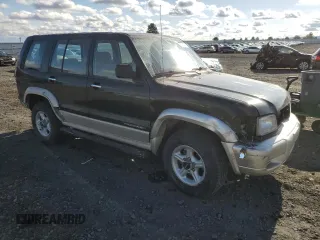2001 Isuzu Trooper S z VIN JACDJ58XX17J02121, wystawiony jako Copart lot #77664704 z przebiegiem 148 752 mil mil oraz Szkody całkowita. Historia ofert i sprzedaży dostępna na DreamBid. Obrazek 4.