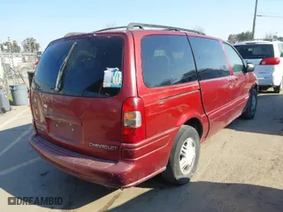 2001 Chevrolet Venture Warner Bros 1SE Pkg with VIN 1GNDX13E01D201117, listed as a IAAI auction lot 41442279 with 148,090 mi miles. Bid and sale history available at carsss.com. Image 4.