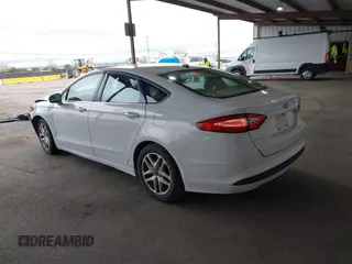 2016 Ford Fusion SE with VIN 3FA6P0H71GR386404, listed as a IAAI auction lot 41974062 with 104,018 mi miles. Bid and sale history available at carsss.com. Image 3.