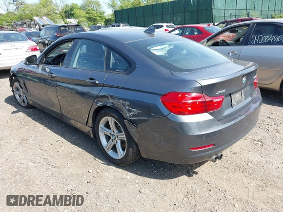 2015 BMW 4 Series 428i xDrive with VIN WBA4C9C55FD331921, listed as a IAAI auction lot 42214901 with 94,970 mi miles and . Bid and sale history available at DreamBid. Image 3.
