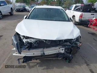 2022 Toyota Camry SE with VIN 4T1G11AK6NU066677, listed as a IAAI auction lot 41892982 with 71,059 mi miles and . Bid and sale history available at carsss.com. Image 6.