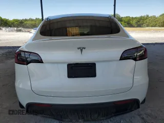 2024 Tesla Model Y с VIN 7SAYGDED5RF086456, выставлен на аукционе Copart как лот 57994835 с пробегом Не указан миль и Списание • Salvage title. История ставок и продаж доступна на DreamBid. Изображение 6.