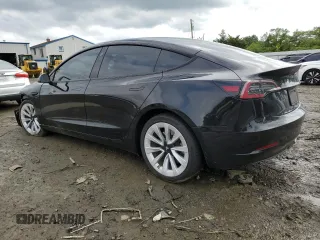 2023 Tesla Model 3 with VIN 5YJ3E1EA3PF451764, listed as a Copart auction lot 58718705 with 33,965 mi miles and Salvage title. Bid and sale history available at DreamBid. Image 2.