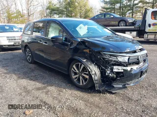 2024 Honda Odyssey Touring z VIN 5FNRL6H89RB042354, wystawiony jako IAAI lot #41469495 z przebiegiem 8 477 mil mil oraz . Historia ofert i sprzedaży dostępna na DreamBid. Obrazek 1.