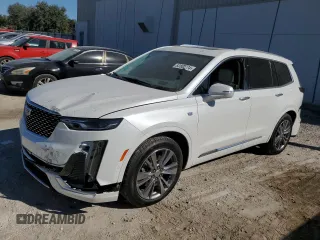 2024 Cadillac XT6 FWD Premium Luxury with VIN 1GYKPCRS4RZ742995, listed as a Copart auction lot 82802774 with 5,898 mi miles and Salvage Title. Bid and sale history available at carsss.com. Image 1.