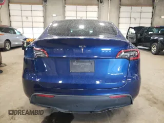 2023 Tesla Model Y Long Range with VIN 7SAYGDEE7PA180793, listed as a Copart auction lot 46706855 with 18,136 mi miles and Non Repairable. Bid and sale history available at DreamBid. Image 6.