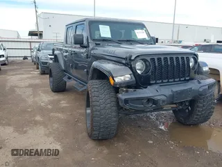 2023 Jeep Gladiator Sport S z VIN 1C6HJTAG9PL554845, wystawiony jako IAAI lot #41312360 z przebiegiem 18 077 mil mil oraz . Historia ofert i sprzedaży dostępna na DreamBid. Obrazek 1.
