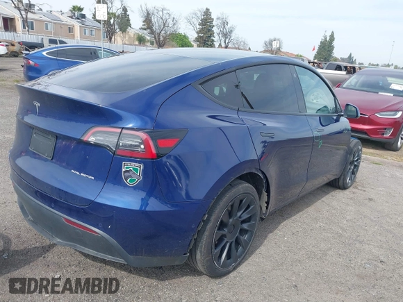 2021 Tesla Model Y Long Range with VIN 5YJYGAEE5MF199286, listed as a IAAI auction lot 41677915 with 52,500 mi miles. Bid and sale history available at carsss.com. Image 4.