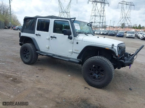 2012 Jeep Wrangler Unlimited Sahara with VIN 1C4BJWEG9CL220965, listed as a IAAI auction lot 41902295 with 120,492 mi miles. Bid and sale history available at carsss.com. Image 1.