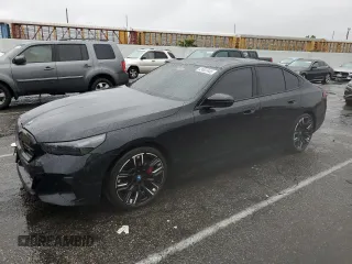 2024 BMW i5 M60 with VIN WBY43FK06RCR21920, listed as a Copart auction lot 43002445 with 26,452 mi miles and Salvage title. Bid and sale history available at DreamBid. Image 1.
