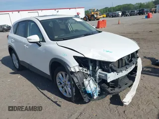 2015 Mazda CX-5 Grand Touring with VIN JM3KE2DY5F0498718, listed as a IAAI auction lot 42070000 with 129,327 mi miles. Bid and sale history available at carsss.com. Image 1.