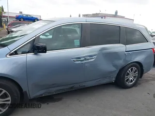 2012 Honda Odyssey EX-L with VIN 5FNRL5H60CB095086, listed as a IAAI auction lot 42251330 with 144,232 mi miles and . Bid and sale history available at DreamBid. Image 14.