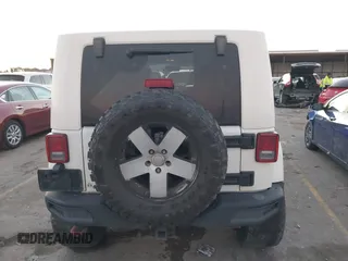 2010 Jeep Wrangler Unlimited Sahara with VIN 1J4BA5H15AL184376, listed as a IAAI auction lot 41270637 with 143,339 mi miles. Bid and sale history available at carsss.com. Image 16.