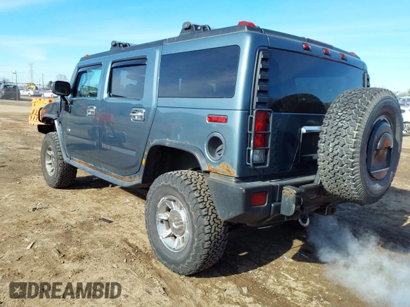2005 Hummer H2 SUV with VIN 5GRGN23U15H117796, listed as a IAAI auction lot 41543913 with 195,560 mi miles. Bid and sale history available at carsss.com. Image 3.