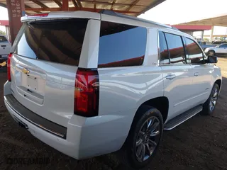 2016 Chevrolet Tahoe LTZ with VIN 1GNSKCKC4GR359442, listed as a IAAI auction lot 41871814 with 158,533 mi miles. Bid and sale history available at carsss.com. Image 4.