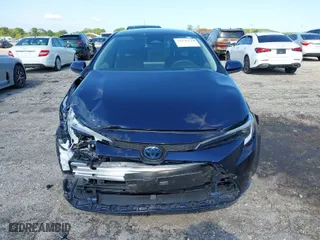 2024 Toyota Corolla Hybrid LE with VIN JTDBCMFE4RJ021466, listed as a IAAI auction lot 41976149 with 21,965 mi miles. Bid and sale history available at carsss.com. Image 12.