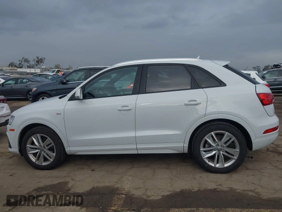 2018 Audi Q3 Premium z VIN WA1BCCFSXJR028356, wystawiony jako IAAI lot #41761544 z przebiegiem 82 877 mil mil oraz . Historia ofert i sprzedaży dostępna na DreamBid. Obrazek 15.
