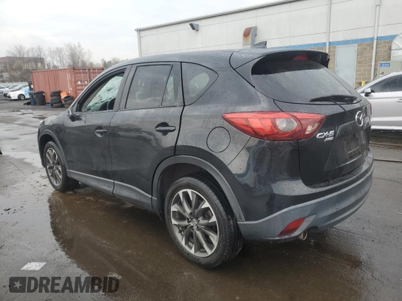 2016 Mazda CX-5 Grand Touring with VIN JM3KE4DYXG0711367, listed as a Copart auction lot 52862405 with 87,870 mi miles and Salvage Title. Bid and sale history available at DreamBid. Image 2.