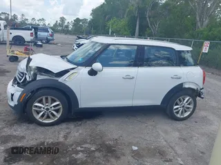 2014 MINI Countryman z VIN WMWZB3C50EWR37412, wystawiony jako IAAI lot #42330526 z przebiegiem 139 310 mil mil oraz . Historia ofert i sprzedaży dostępna na DreamBid. Obrazek 15.