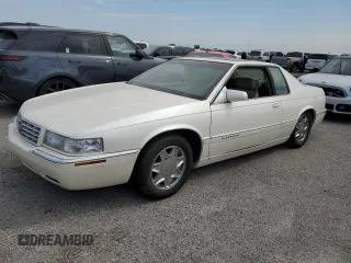 1999 Cadillac Eldorado z VIN 1G6EL12Y7XU615169, wystawiony jako Copart lot #76459744 z przebiegiem Nie podano mil oraz Szkoda całkowita • Salvage title. Historia ofert i sprzedaży dostępna na DreamBid. Obrazek 1.