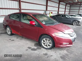 2010 Honda Insight EX with VIN JHMZE2H74AS033674, listed as a IAAI auction lot 41953858 with 144,018 mi miles and . Bid and sale history available at carsss.com. Image 1.