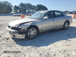 1999 Mazda Millenia with VIN JM1TA2217X1502746, listed as a Copart auction lot 72165894 with 196,957 mi miles and Salvage Title. Bid and sale history available at DreamBid. Image 1.