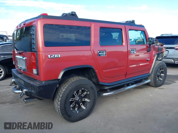 2003 Hummer H2 with VIN 5GRGN23U23H104200, listed as a IAAI auction lot 41687769 with 1 mi miles. Bid and sale history available at carsss.com. Image 4.