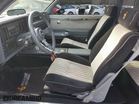 1987 Buick Regal with VIN 1G4GJ1174HP443571, listed as a Copart auction lot 83341634 with 53,709 mi miles and Salvage Title. Bid and sale history available at DreamBid. Image 7.