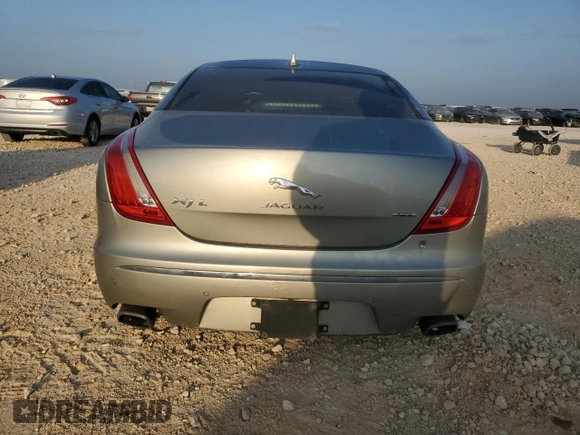 2014 Jaguar XJ Portfolio with VIN SAJWJ2GD7E8V61558, listed as a Copart auction lot 66850034 with 130,984 mi miles and Salvage title. Bid and sale history available at DreamBid. Image 6.