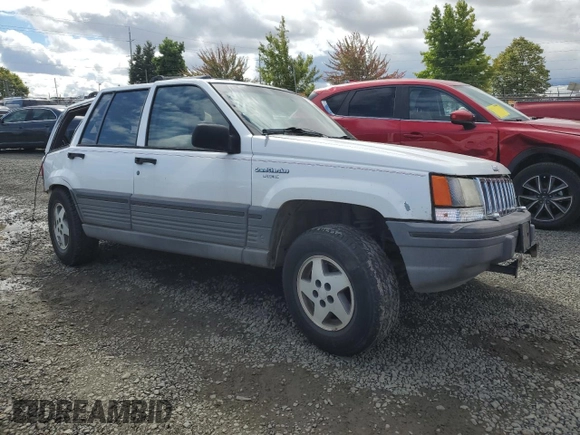 1994 Jeep Grand Cherokee Laredo with VIN 1J4GZ58Y2RC207099, listed as a Copart auction lot 71176114 with 127,110 mi miles and Salvage Title. Bid and sale history available at carsss.com. Image 4.