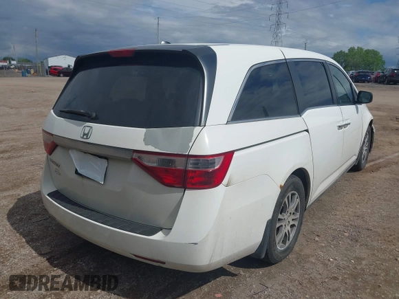 2012 Honda Odyssey EX-L with VIN 5FNRL5H63CB117341, listed as a IAAI auction lot 42197815 with 256,544 mi miles and . Bid and sale history available at DreamBid. Image 4.