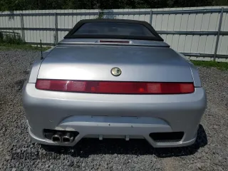 1996 Alfa Romeo Spider z VIN ZAR91600006013048, wystawiony jako Copart lot #62495174 z przebiegiem 143 888 mil mil oraz Szkody całkowita. Historia ofert i sprzedaży dostępna na DreamBid. Obrazek 6.
