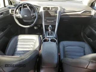 2013 Ford Fusion SE Hybrid z VIN 3FA6P0LU6DR325719, wystawiony jako Copart lot #55777715 z przebiegiem 152 478 mil mil oraz Szkoda całkowita • Salvage title. Historia ofert i sprzedaży dostępna na DreamBid. Obrazek 8.