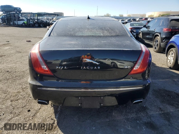 2014 Jaguar XJ with VIN SAJWA2GZXE8V59542, listed as a Copart auction lot 73672614 with 105,328 mi miles and Salvage Title. Bid and sale history available at carsss.com. Image 6.