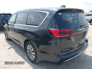 2023 Chrysler Pacifica Hybrid Touring L with VIN 2C4RC1L75PR592251, listed as a IAAI auction lot 42037873 with 44,428 mi miles and . Bid and sale history available at DreamBid. Image 3.