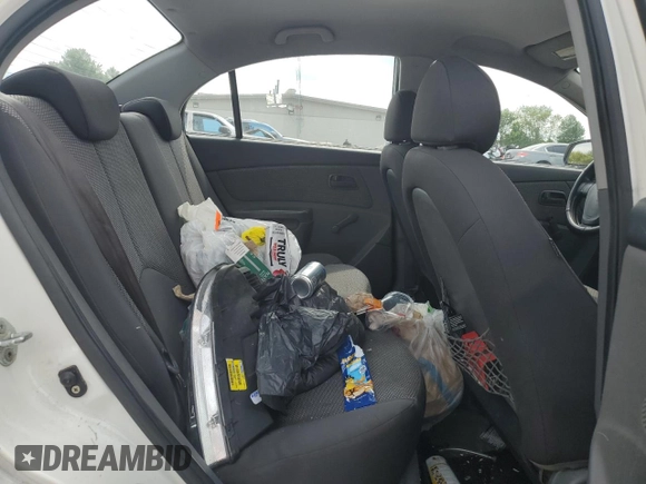 2009 Kia Rio LX with VIN KNADE223996526222, listed as a Copart auction lot 69976484 with 318,702 mi miles and Salvage Title. Bid and sale history available at DreamBid. Image 10.